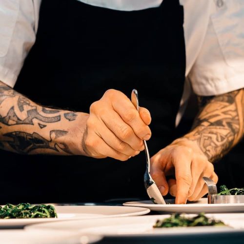 picture of a chef preparing dishes