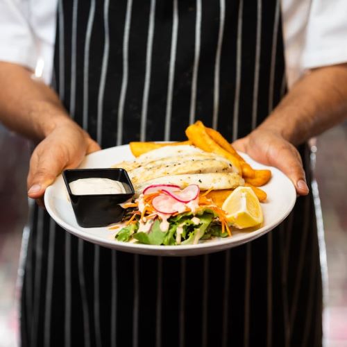 picture of a chef preparing dishes